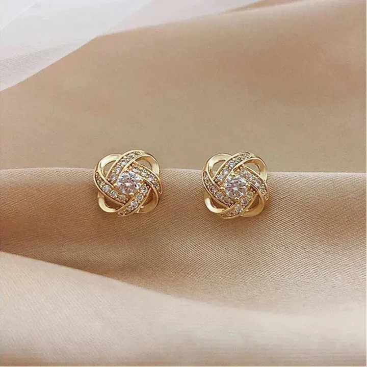 Pendientes dorados en espiral floral con cristales