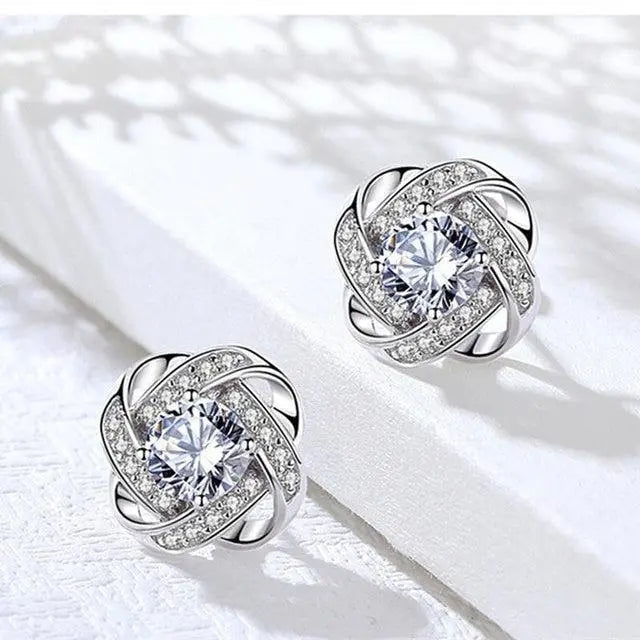 Pendientes dorados en espiral floral con cristales