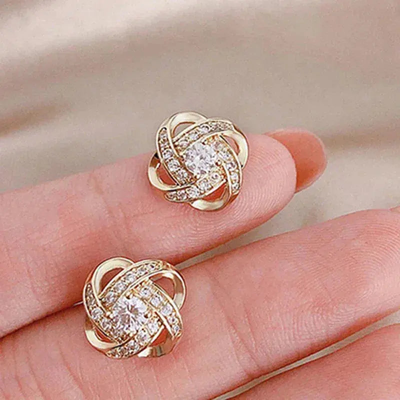 Pendientes dorados en espiral floral con cristales