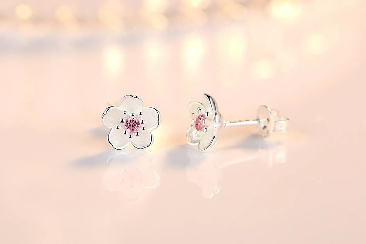 Pendientes de botón en forma de flor con zirconitas
