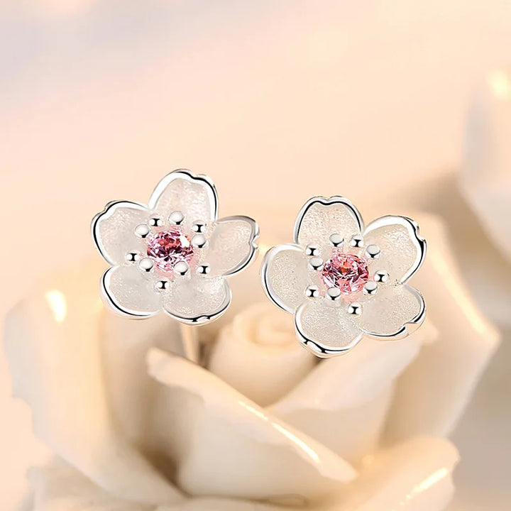 Pendientes de botón en forma de flor con zirconitas