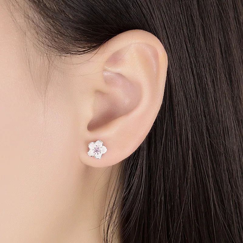 Pendientes de botón en forma de flor con zirconitas