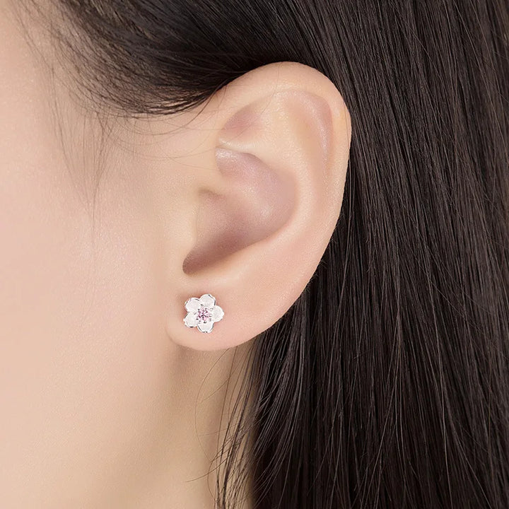 Pendientes de botón en forma de flor con zirconitas