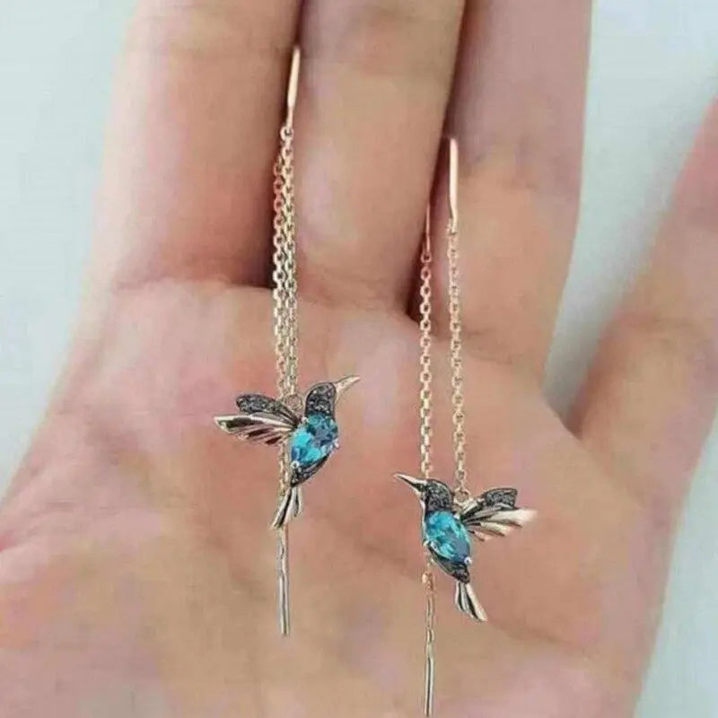 Pendientes de hilo con colibrí de oro y cristales