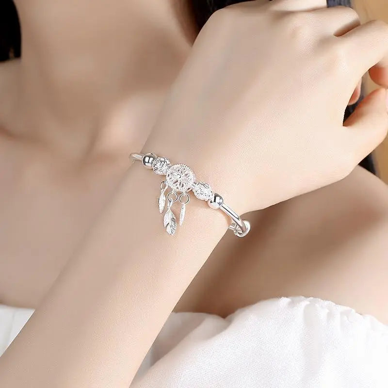 Pulsera de plata con colgante atrapa sueños